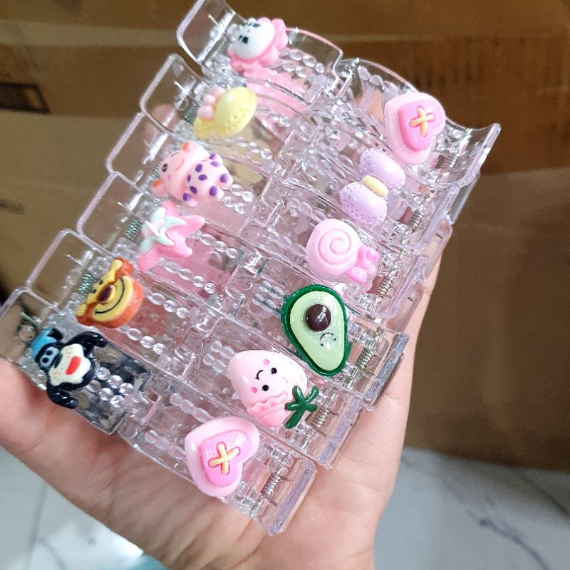 Sỉ lố 12 kẹp càng cua gắn icon hoạt hình mix