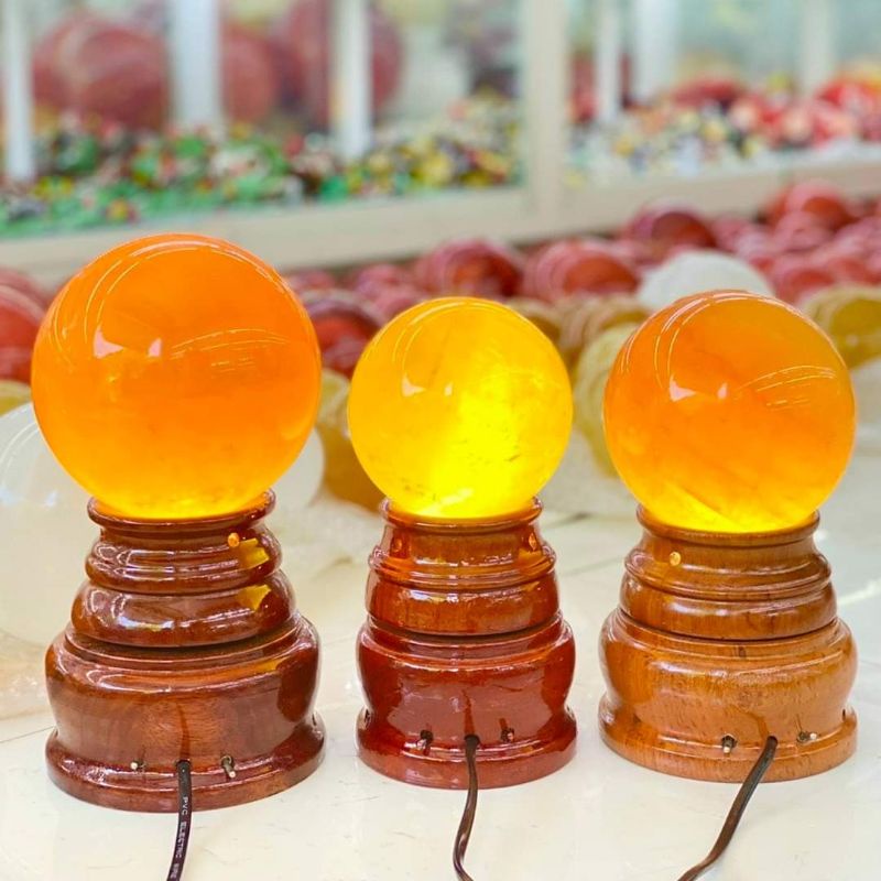Quả bi cầu phong thủy canxit vàng từ 6cm đến 20cm tặng đế gỗ đẹp