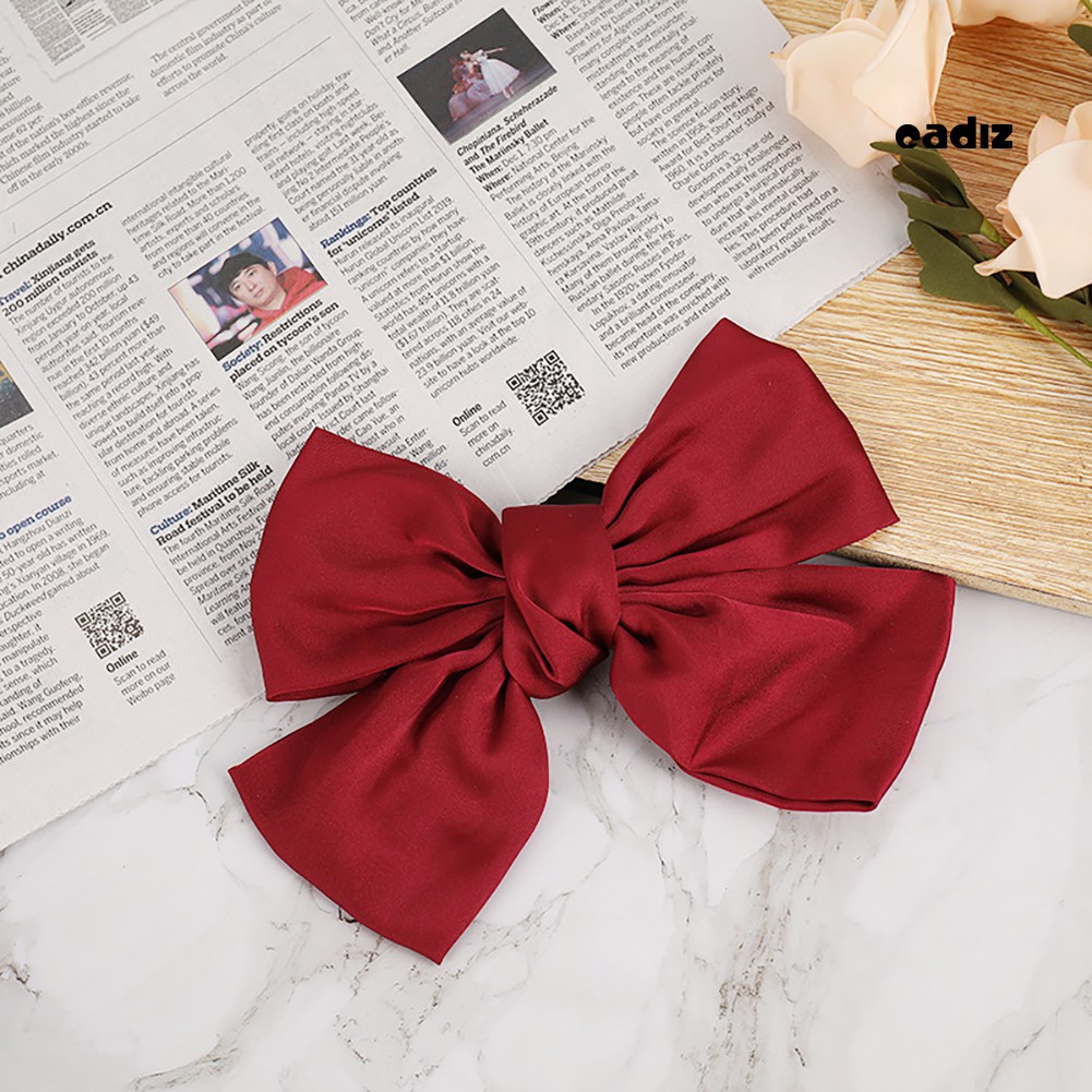 Kẹp tóc nơ màu trơn xinh xắn đáng yêu