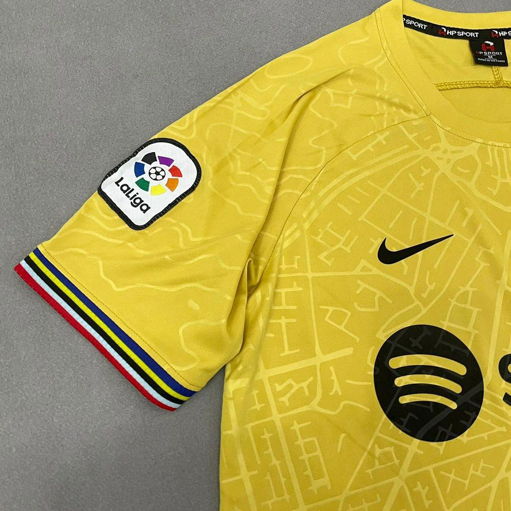 Bộ quần áo đá banh Barca Vàng đồng HP 2023FLG
