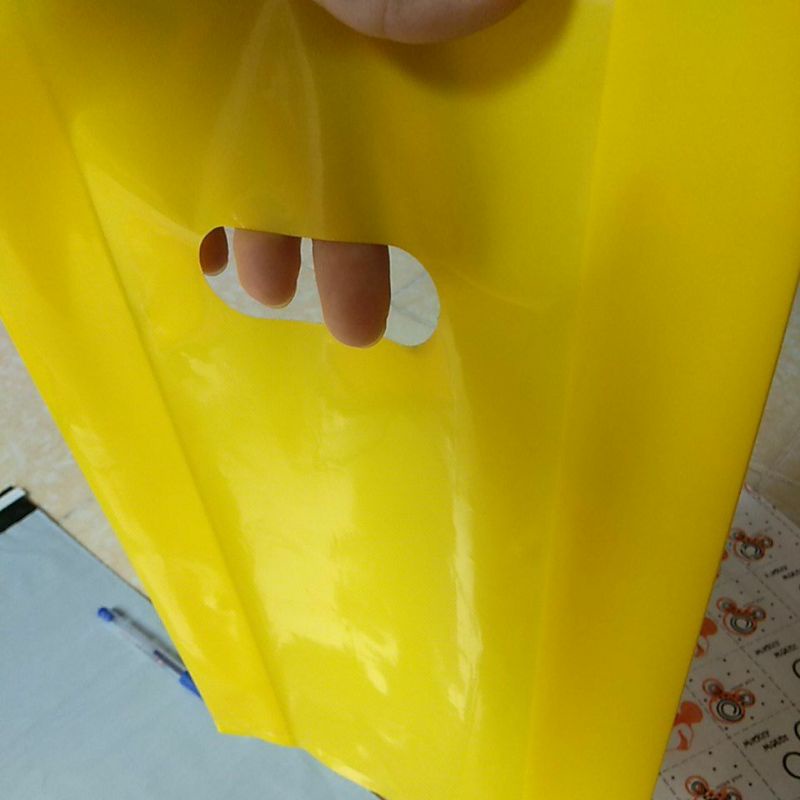 (Màu vàng chanh) 500gam túi nilong đựng hàng hột xoài có quai xách PE bóng dẻo, túi shop loại 1