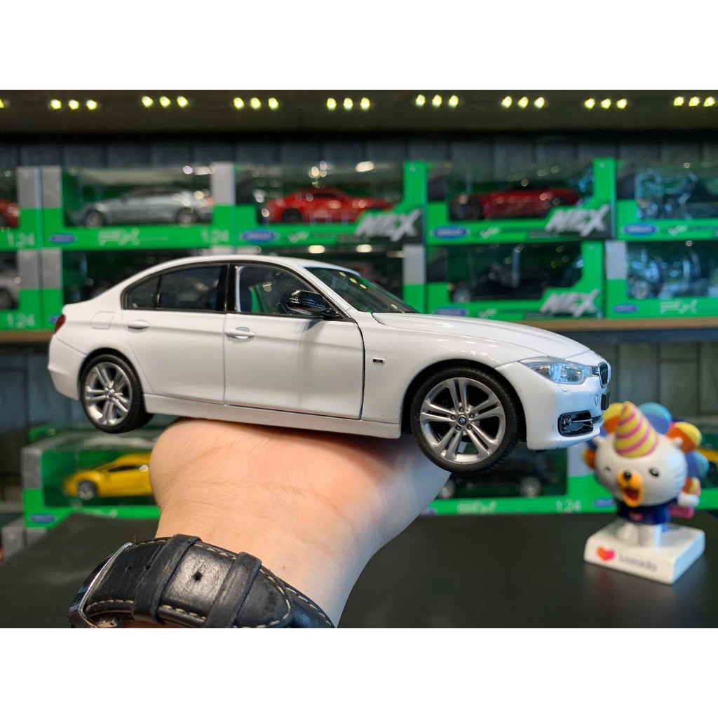 [Mã TOYDEC hoàn 20K xu đơn 50K] Xe mô hình hợp kim siêu xe BMW 335i tỉ lệ 1:24 hãng Welly màu trắng