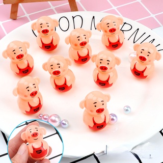 1 đồ chơi lật đật hình chú heo mini