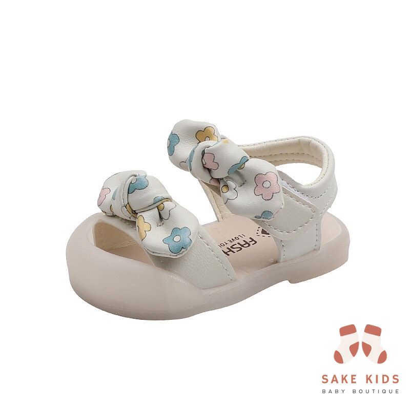 Sandal tập đi chống vấp phối nơ hình Bông hoa mũi có đế chống trơn trượt kiểu dáng Hàn Quốc mới nhất M865