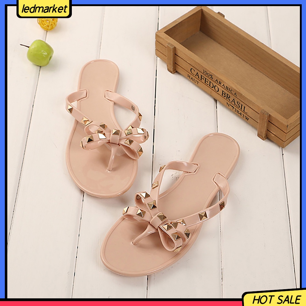 Dép đi biển phối nơ và đinh thời trang mùa hè dành cho nữ