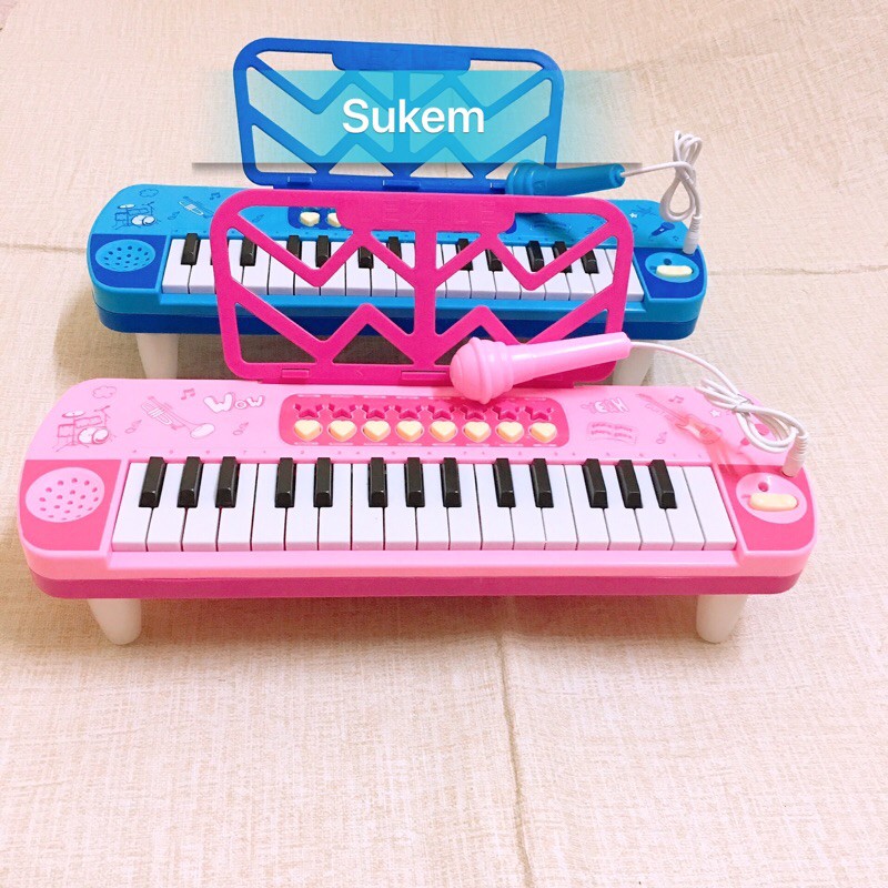 Đồ chơi đàn nhạc cho bé kèm mic hát màu xanh, hồng