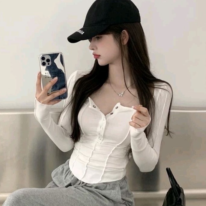 Áo thun kiểu choàng hở vai 1 bên và vạt bầu tay dài cài nút  A15