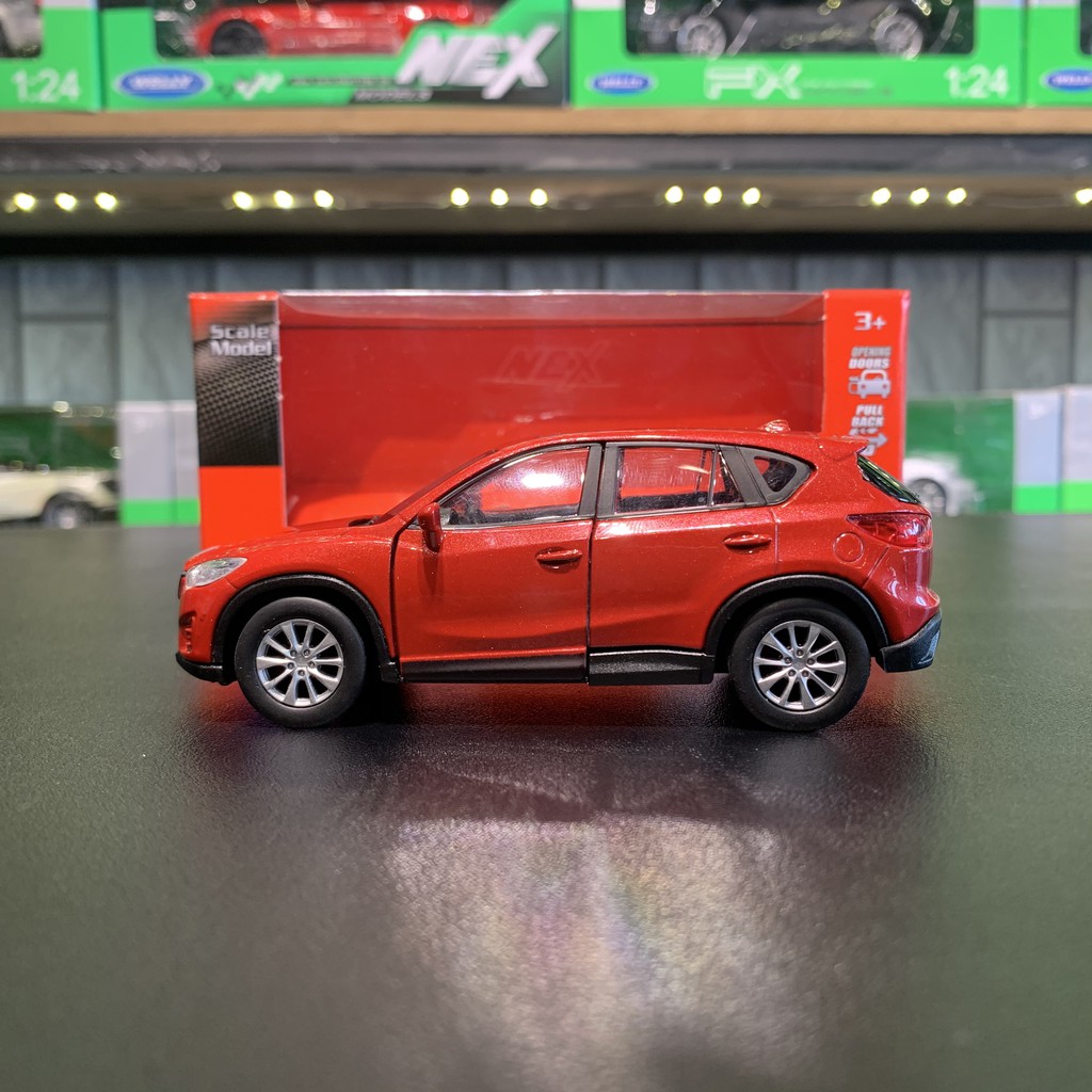 Mô hình xe ô tô Mazda Cx5 tỉ lệ 1:36 hãng Welly màu đỏ