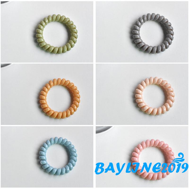 Dây buộc tóc co giãn màu trơn xoắn ốc không để lại dấu vết cho nữ