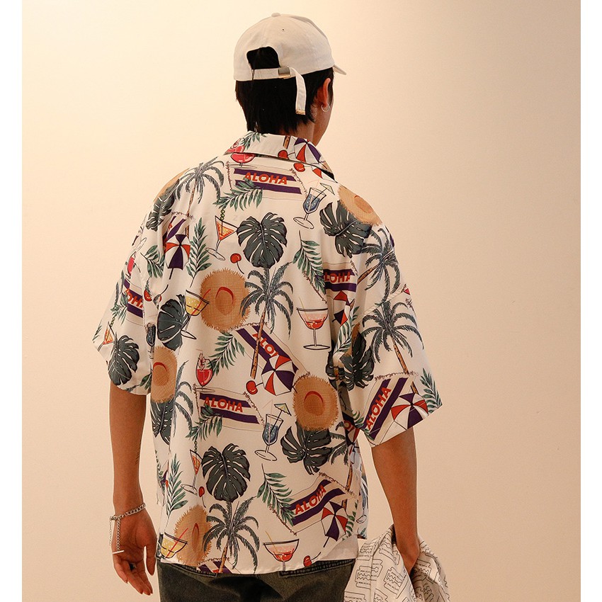 Spot new men and women couples wild personality Hawaii seaside holiday loose trend fashion short-sleeved flower shirt
