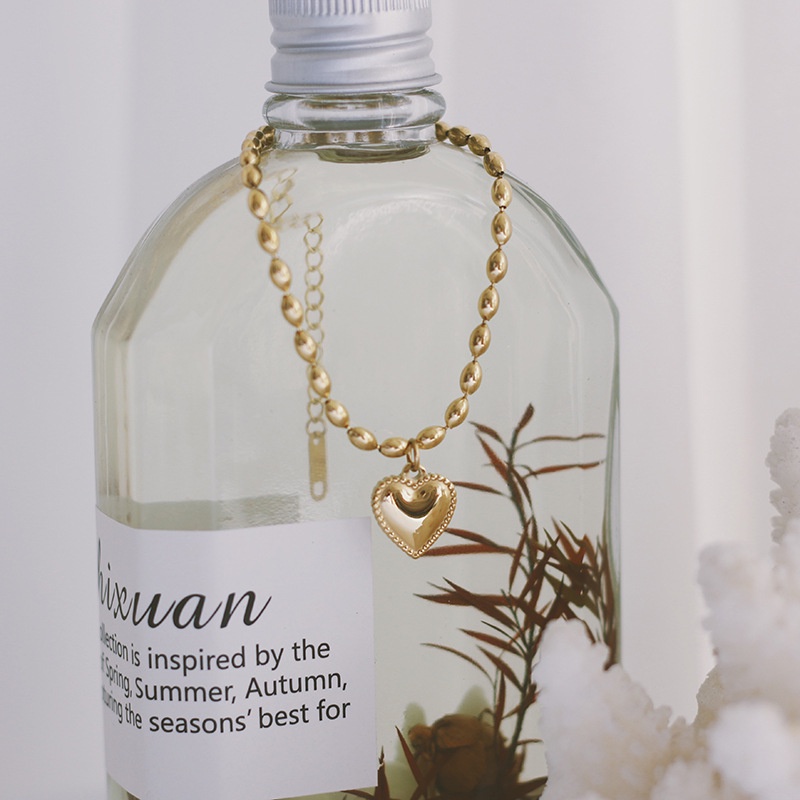 Lắc tay titan chuỗi hạt gạo phối trái tim không gỉ