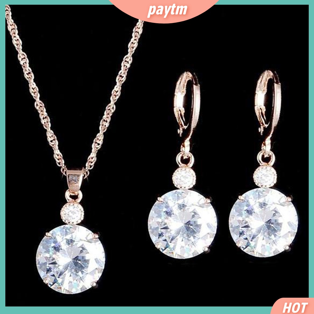 Bộ nữ trang gồm dây chuyền mặt đá tròn và bông tai thời trang