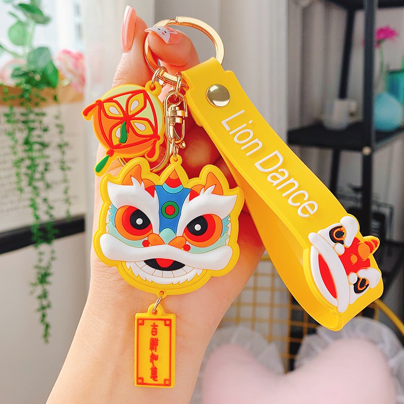 Móc khóa nhựa dẻo hình đầu Lân cá tính