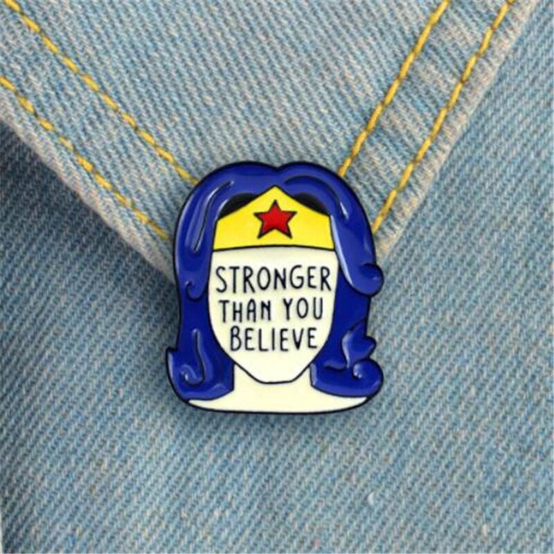 Pin cài áo phụ nữ mạnh mẽ hơn chúng ta nghĩ Stronger Than You Believe - GC284