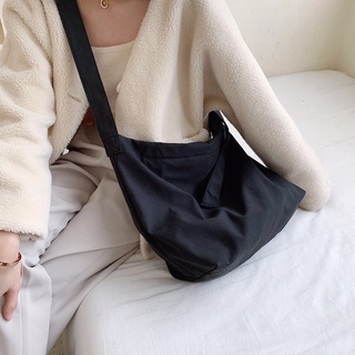 Túi đeo chéo dây rút vải canvas