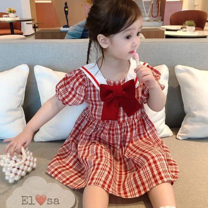 Váy nơ caro xinh cho bé