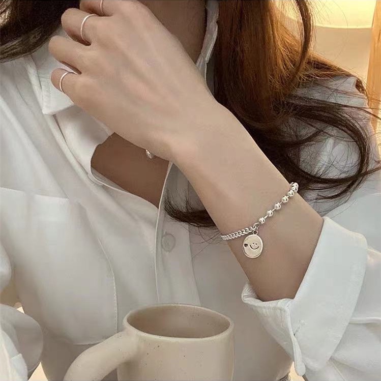 Vòng tay phối hạt giả ngọc trai và hình mặt cười thời trang Hàn Quốc