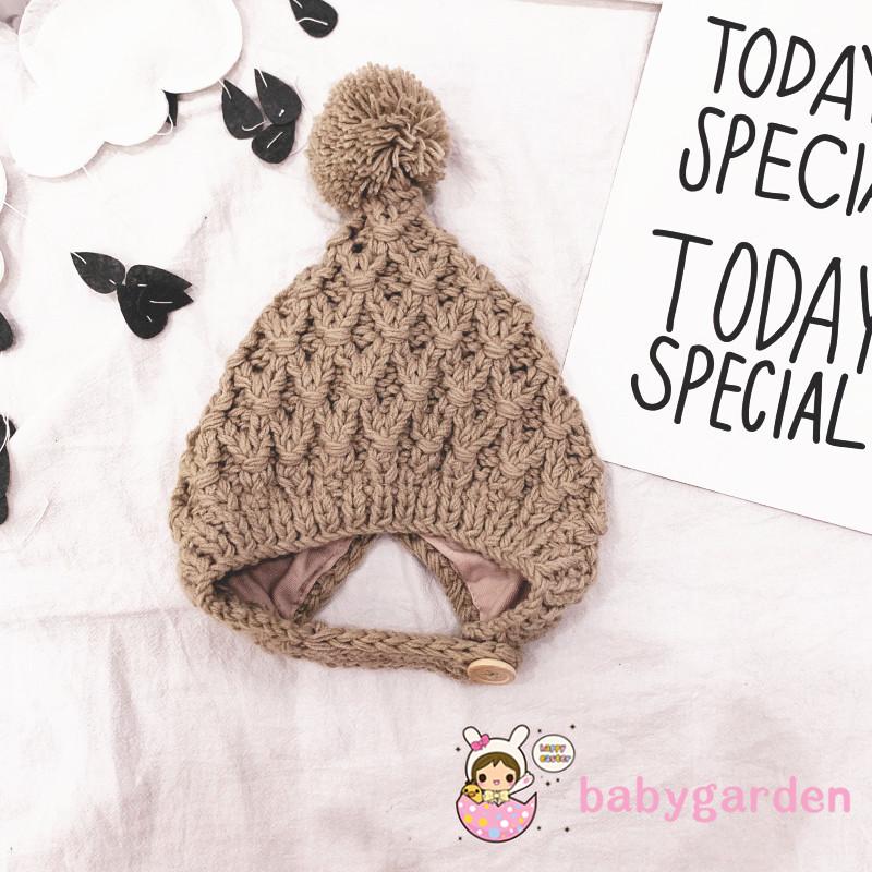 Mũ len trùm tai màu trơn có quả bông dễ thương cho trẻ em