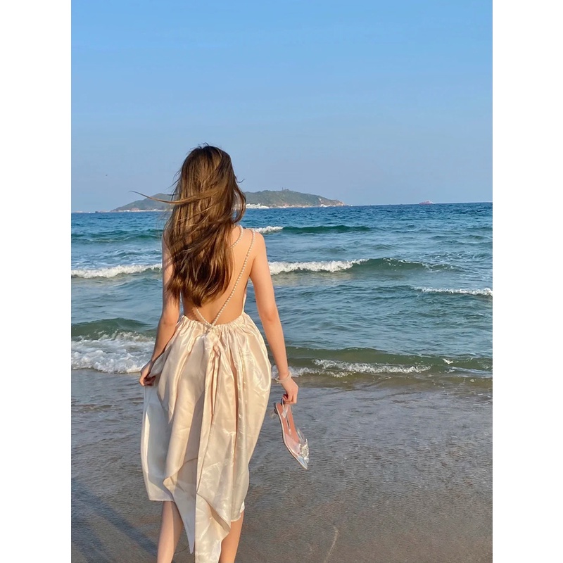 Đầm lụa bóng midi màu be hở lưng đính nơ siêu đẹp Lydia
