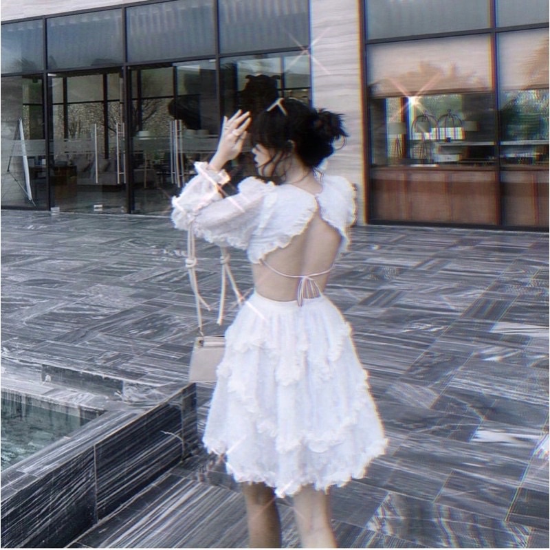 ĐẦM LÔNG VŨ TRẮNG XOÈ TAY DÀI HỞ LƯNG