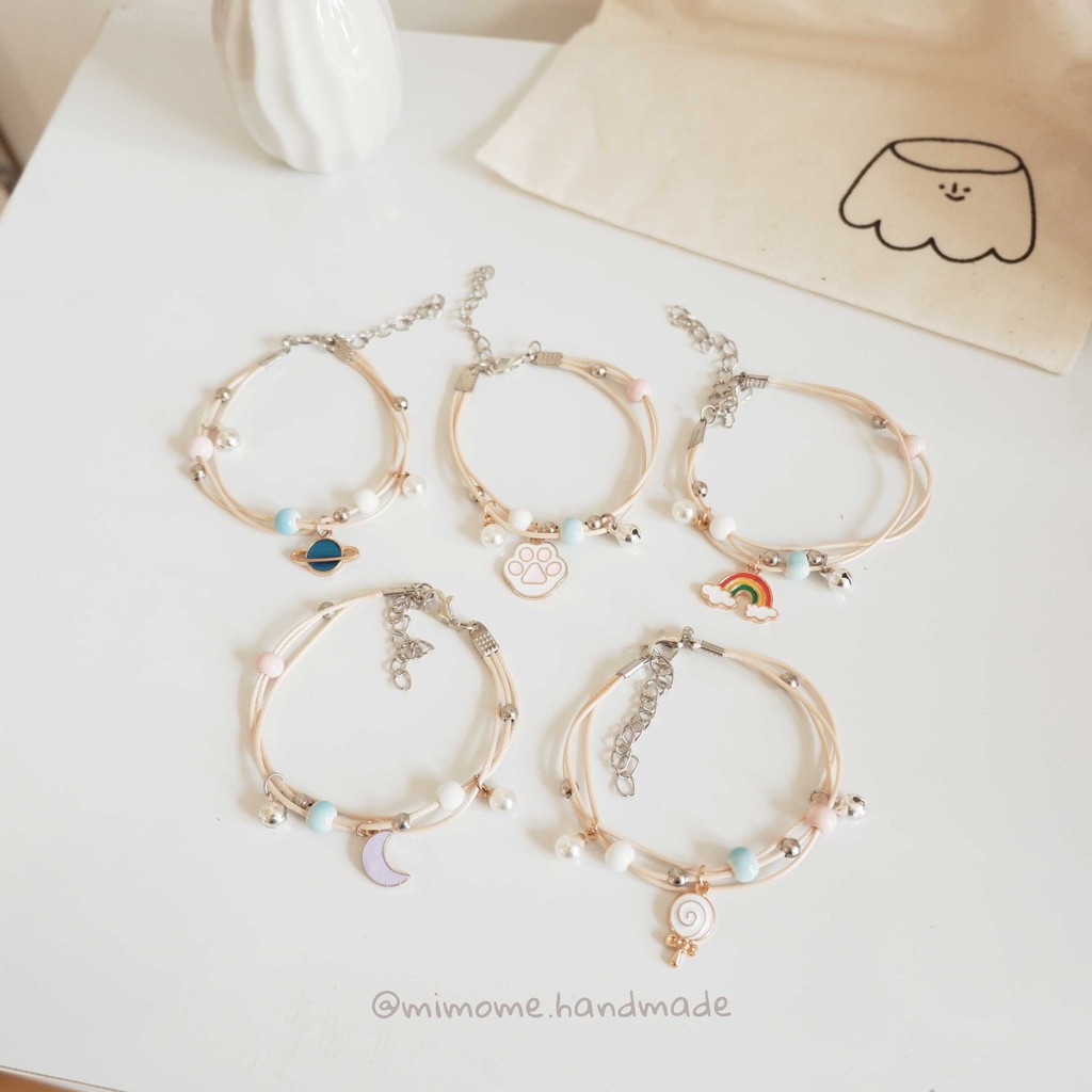 Vòng gốm phối charm màu móc kim loại