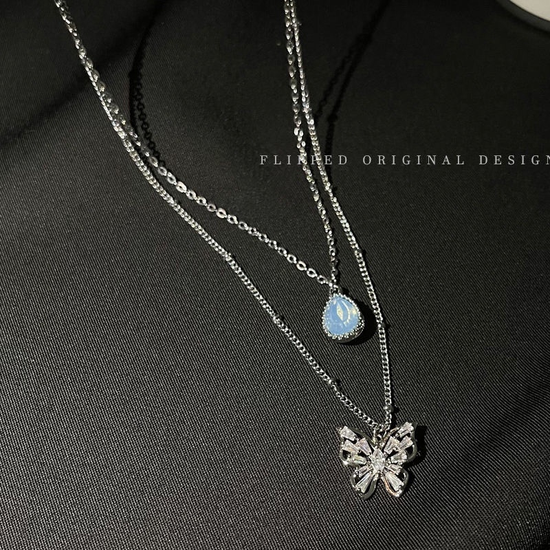 Vòng cổ thép titan phối mặt hình bướm và đá zircon xanh lam nhạt nhân tạo duyên dáng thời trang