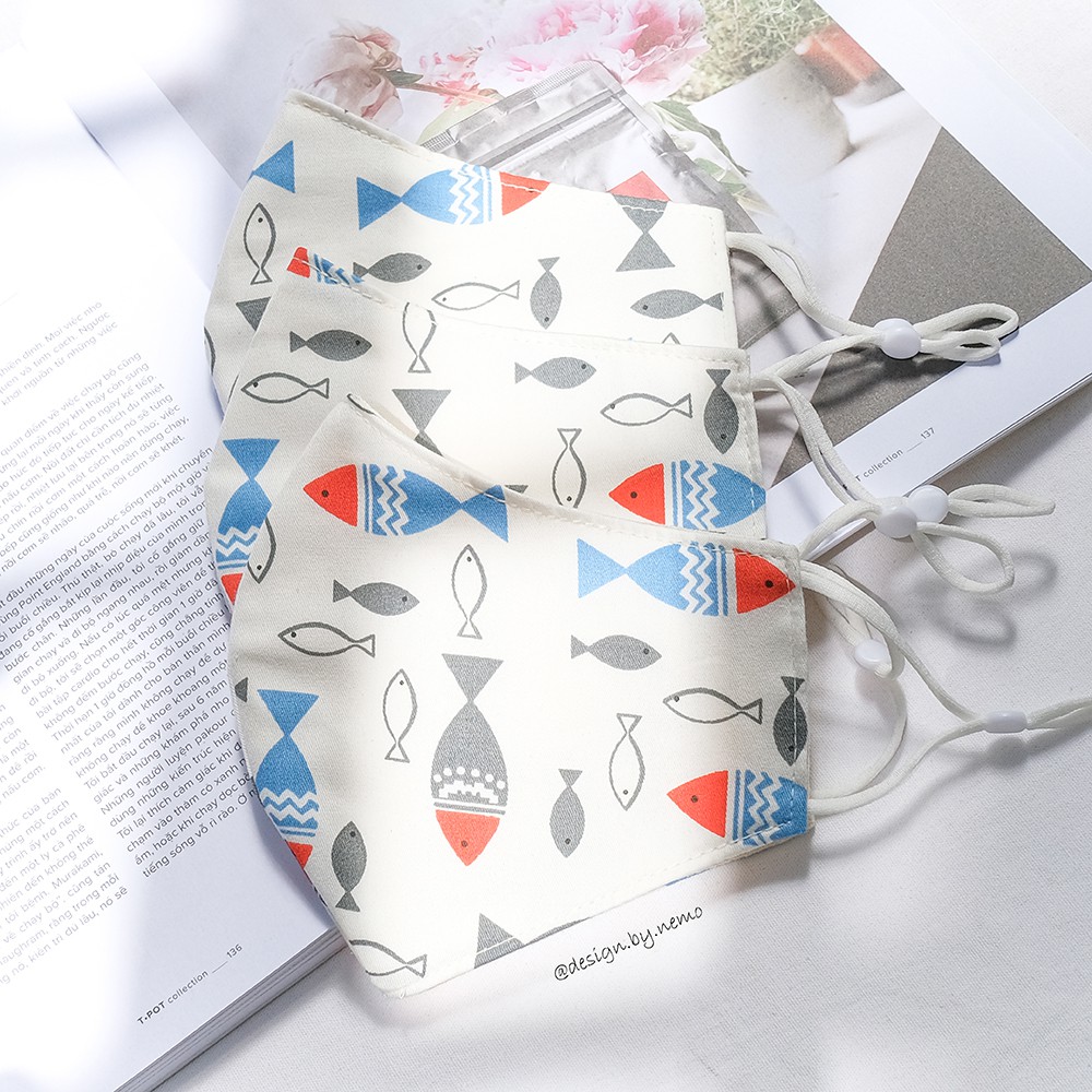 Khẩu Trang Vải Nemo Handmade Họa tiết Cá nền trắng nổi bật, có nút tăng giảm dây tiện lợi - KTCaNenTrang | BigBuy360 - bigbuy360.vn