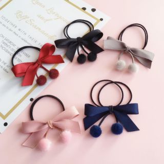 Cột tóc nơ cục bông