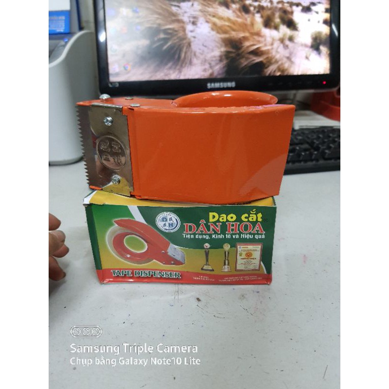 Cắt băng dính cầm tay DÂN HOA 6cm