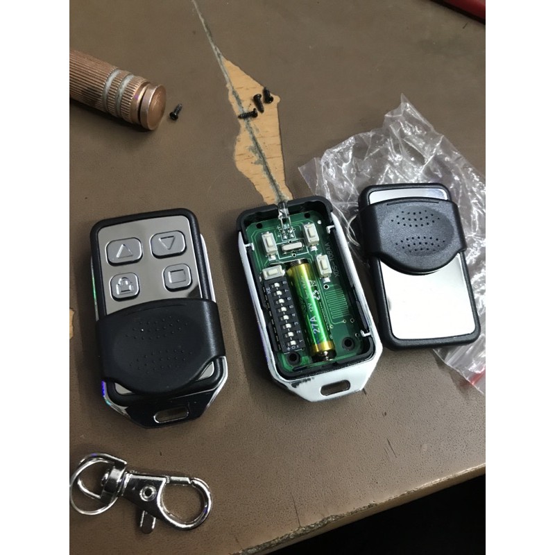 Tay khiển remote cửa cuốn mã gạt 433 Hàng chính hãng