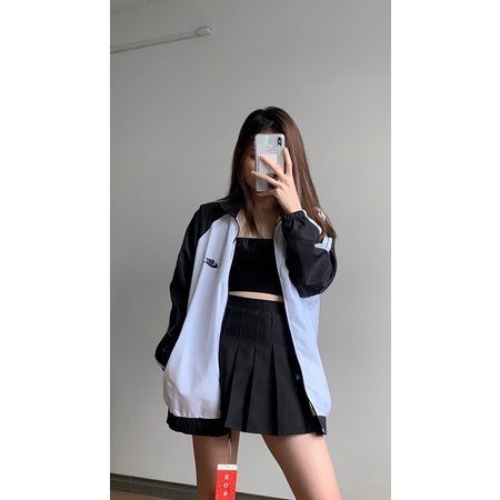 Áo khoác gió nữ form rộng tay phối sọc Nike