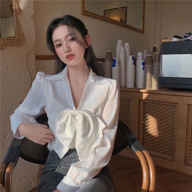 Áo sơ mi nữ màu trắng tay phồng cột nơ trước vải lụa satin