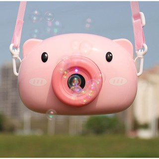 Máy ảnh heo hồng thổi bong bóng
