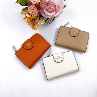 Ví nữ Coach khoá cài da thật màu trơn mới