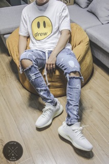 Bleached waxed zipper jeans
