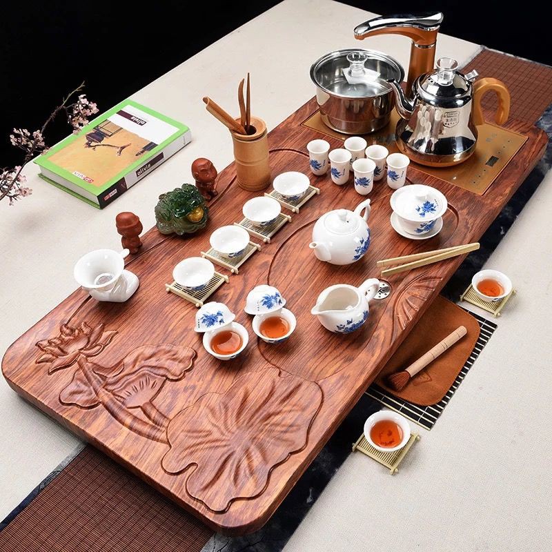 Bộ ấm trà gia dụng hoàn chỉnh gỗ nguyên khối khay Kung Fu gốm sứ tím cát đạo bàn tối giản hiện đại Trung Quốc biển