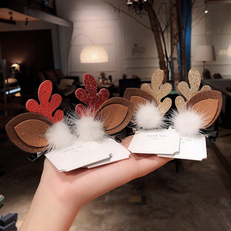 Kẹp tóc đính quả bóng lông và họa tiết sừng tuần lộc đáng yêu cho nữ dịp Giáng Sinh