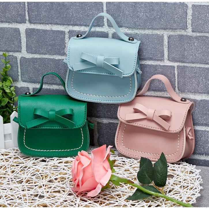 Túi đeo chéo mini đính nơ dễ thương cho bé gái