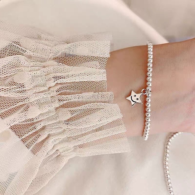 Vòng tay dây cước charm mạ bạc ngọc trai nhân tạo