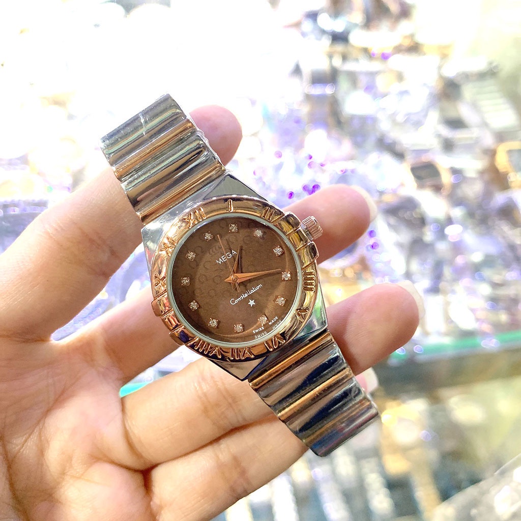 Đồng hồ OMG nữ dây thép không gỉ, viền mặt đính đá, bảo hành 12 tháng