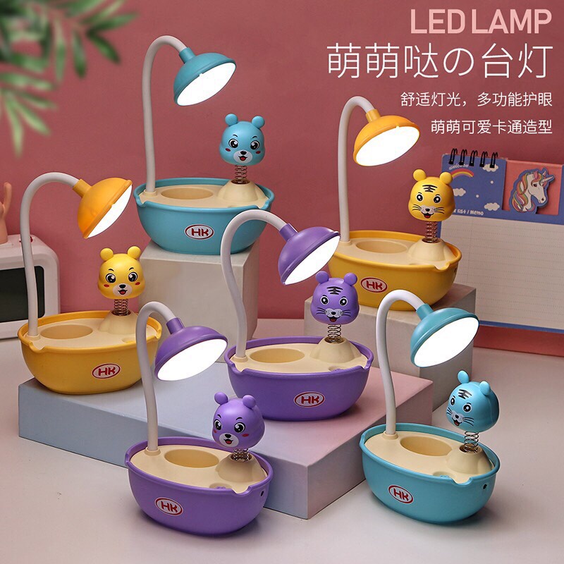 Đèn học chống cận để bàn có pin tích điện đèn led lò xo hình thú có ống cắm bút
