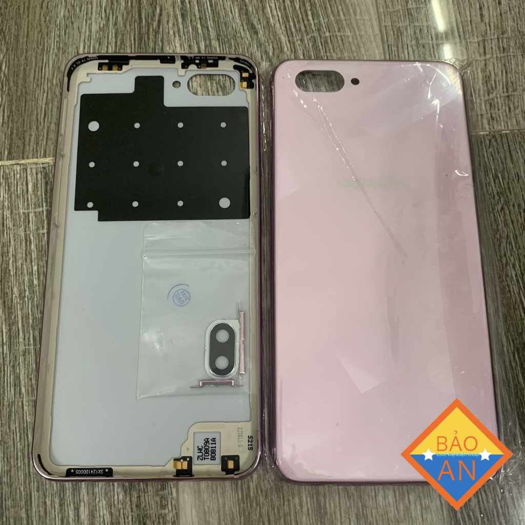 lưng oppo A3S - 32g ( lỗ tróc sim trên ) gồm lưng ,kính cam ,nút bấn