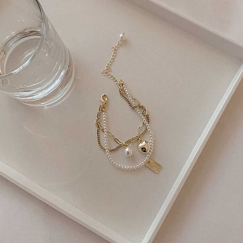 Vòng Tay Nhiều Lớp Đính Hạt Ngọc Trai Mặt Hình Trái Tim Thời Trang Cho Nữ