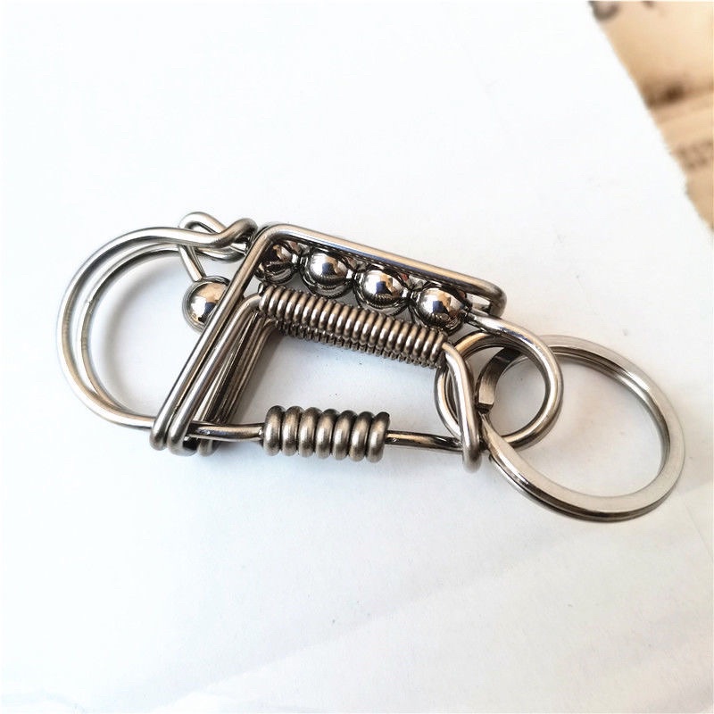 Móc khoá inox làm thủ công bằng que hàn 2 ly phối trụ đốt tre và bi càng dùng càng sáng loáng