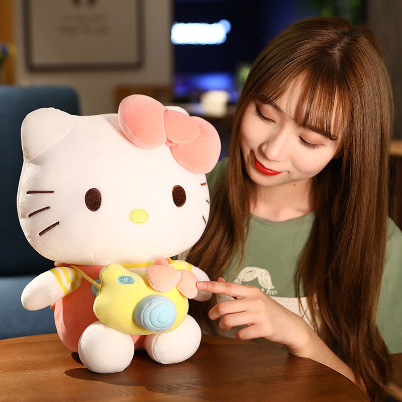 Gấu bông Kitty đeo máy ảnh kích thước 35-45-55cm NEOCI