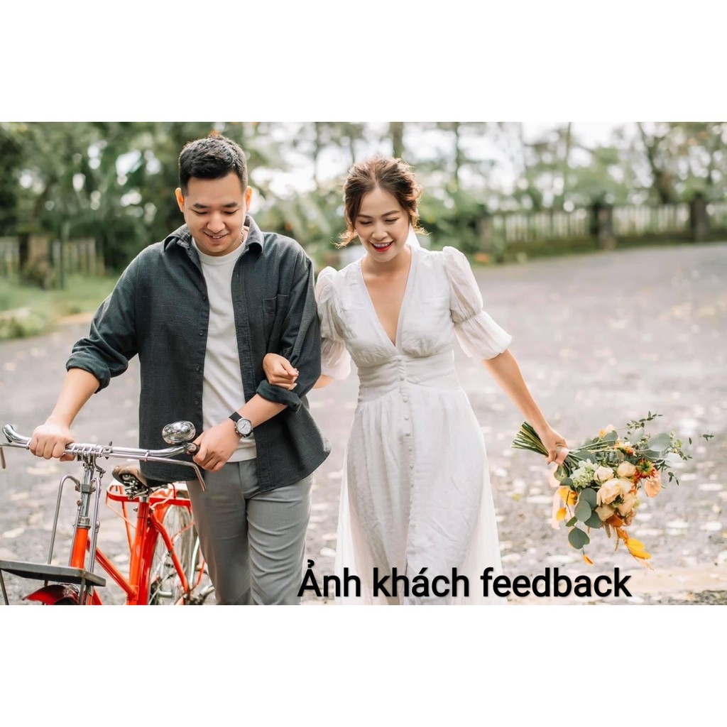 Đầm xốp trắng cổ V nút bọc