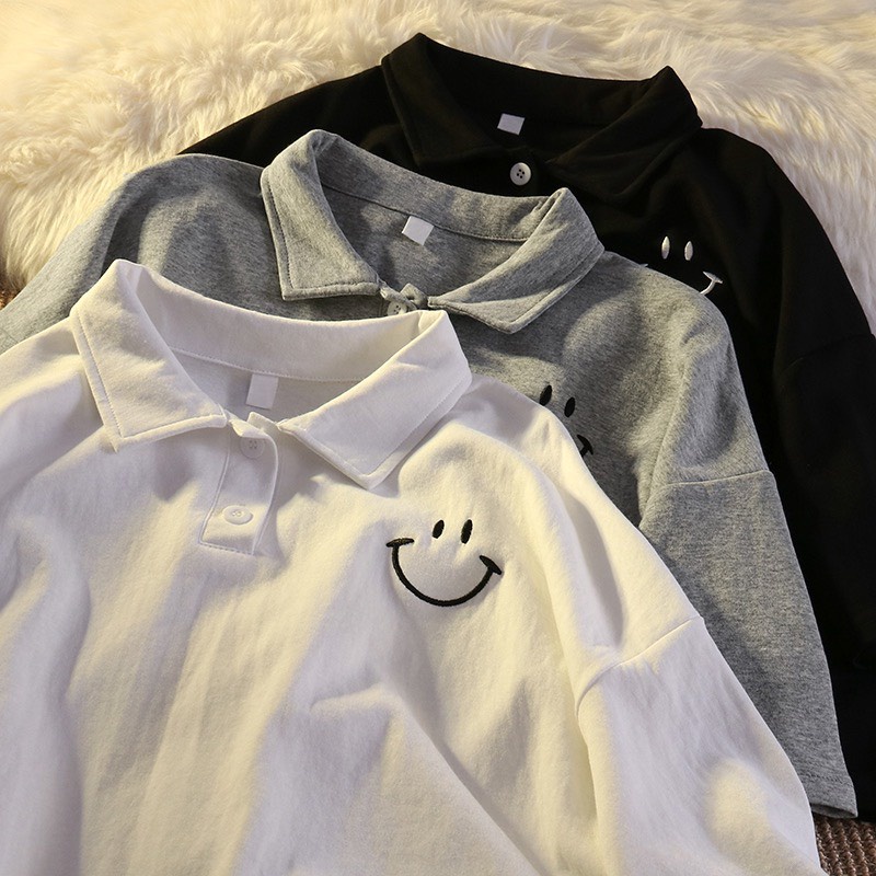 Áo polo nam nữ đều mặc được, thêu  SMILE là điểm nhấn, gồm 3 màu đen trắng xám chất cotton