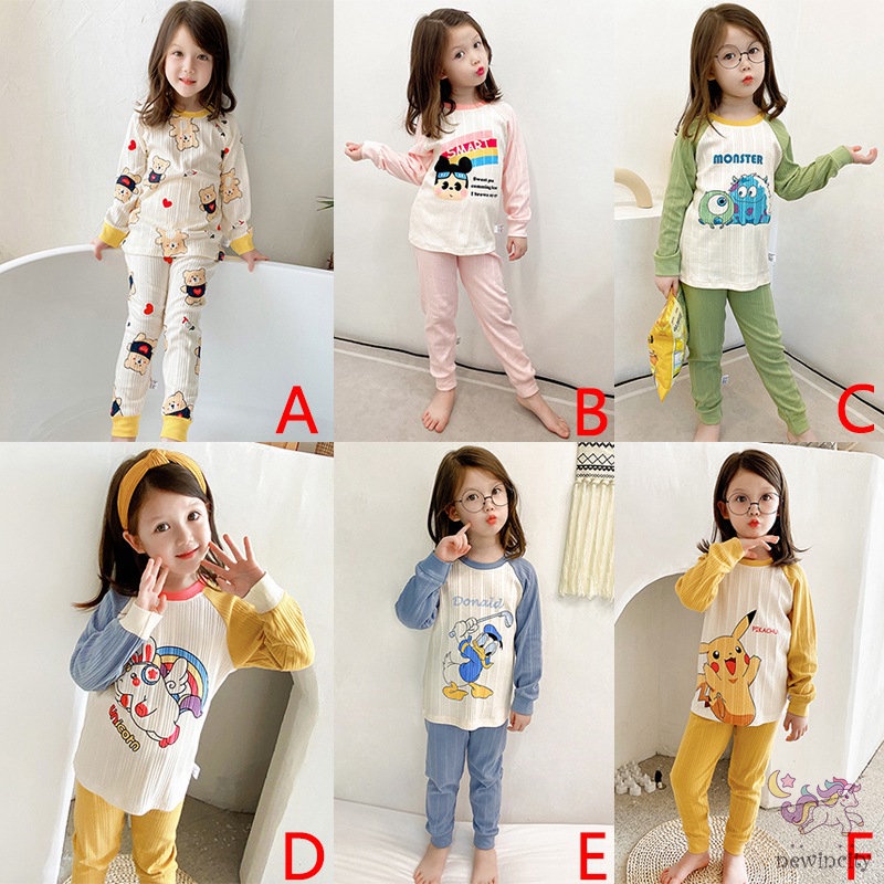 Bộ trang phục gồm áo và quần bó sát lưng cao họa tiết hoạt hình màu tươi sáng kiểu dáng Hàn Quốc thoải mái cho bé gái