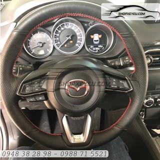 Da bọc vô lăng mazda đời facelift
