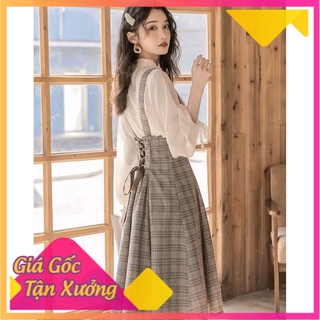 Set áo sơ mi trắng tay dài + váy yếm caro nâu đan dây